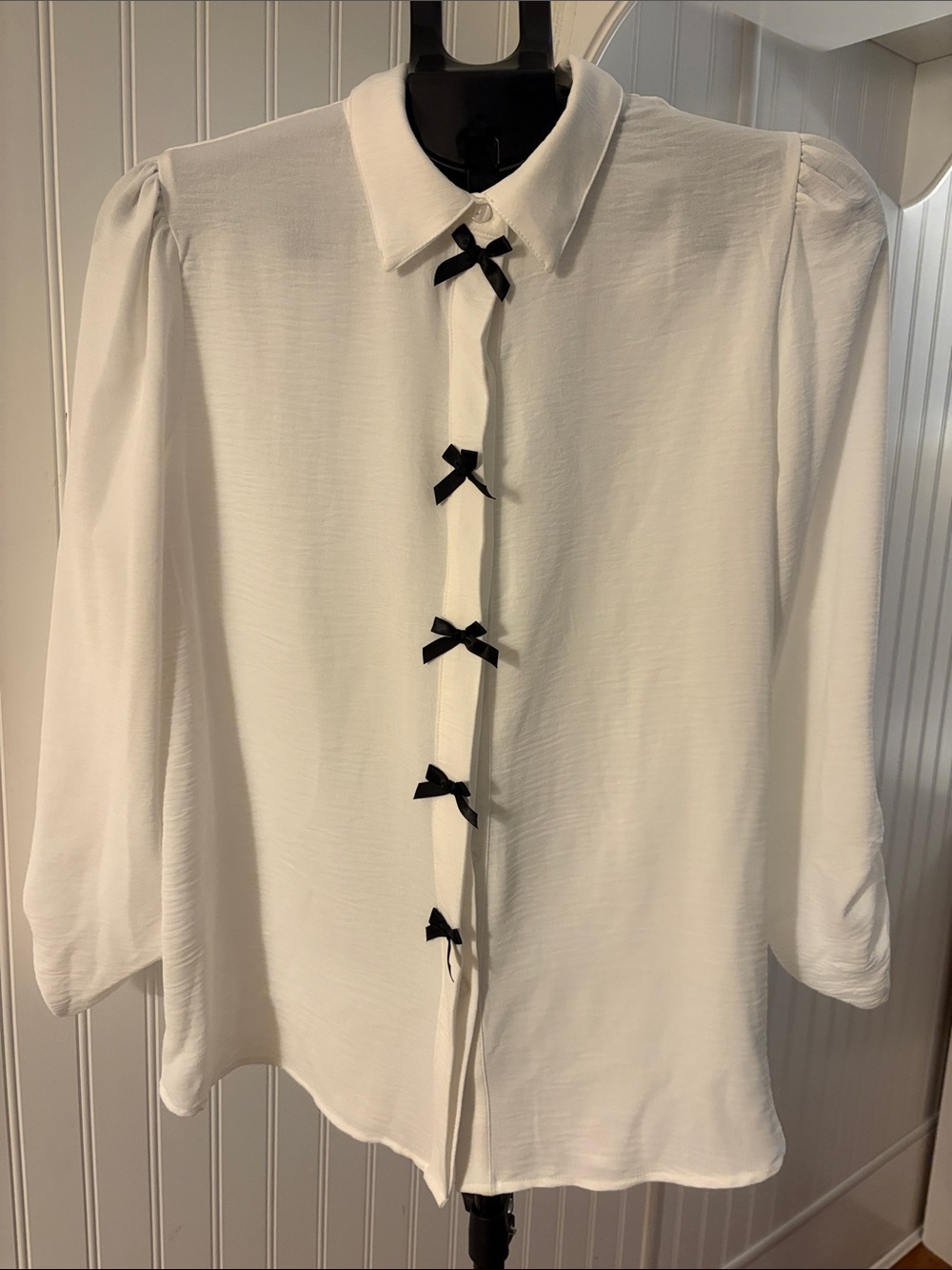 White Blouse with Black Bow Accents